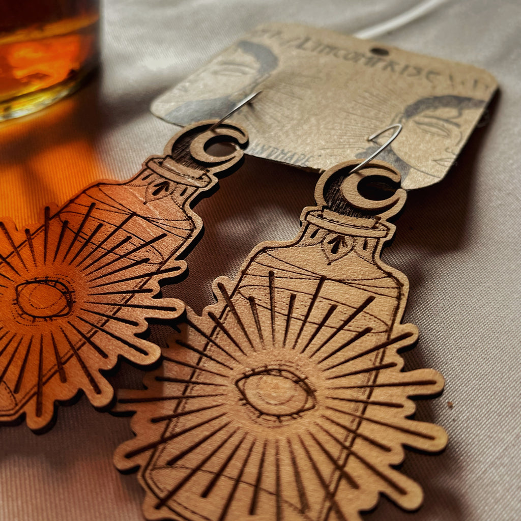 Boucles d’oreilles pendantes - Fiole rayonnante 